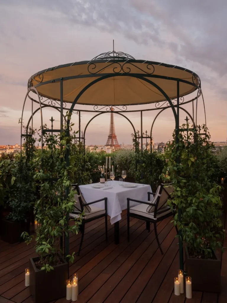 Private rooftop dining dome surrounded by greenery at The Peninsula Paris
