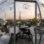 Elegant table setting inside a rooftop dining dome at The Peninsula Paris