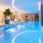 Rooftop swimming pool at The Peninsula Paris with a view over the city
