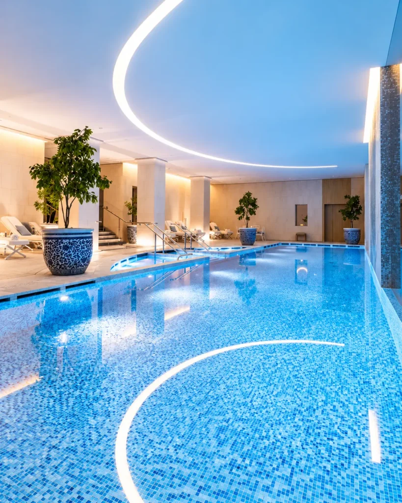 Rooftop swimming pool at The Peninsula Paris with a view over the city