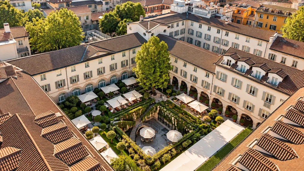 Aerial view of the historic hotel complex and lush inner garden courtyard at Four Seasons Hotel Milano