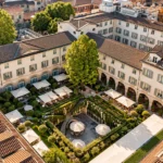 Aerial view of the historic hotel complex and lush inner garden courtyard at Four Seasons Hotel Milano