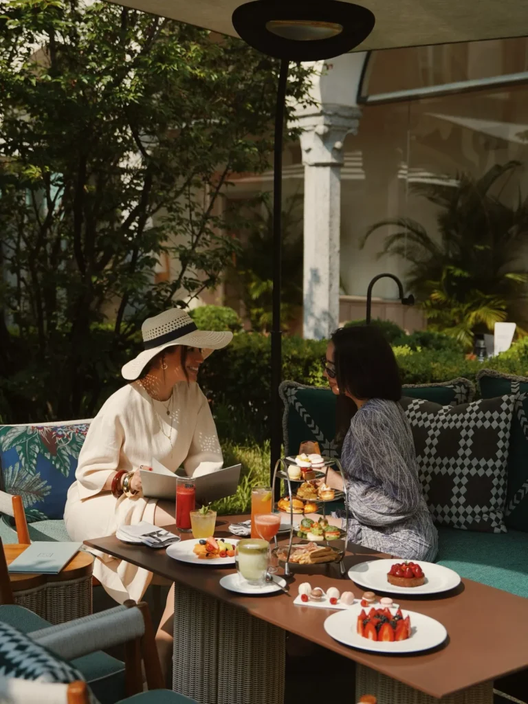 Outdoor dining experience in the leafy courtyard garden at Four Seasons Hotel Milano