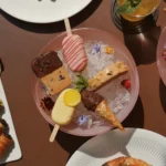 Overhead view of gourmet dishes and elegant table settings during a dining experience at Four Seasons Hotel Milano