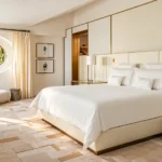 Serene hotel bedroom with neutral tones, a comfortable bed and refined contemporary furnishings at Four Seasons Hotel Milano