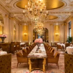 Opulent Parisian banquet room featuring crystal chandeliers, ornate ceilings and elegant dining tables