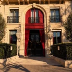 La Réserve Paris luxury hotel entrance with red curtains and classic Parisian architecture