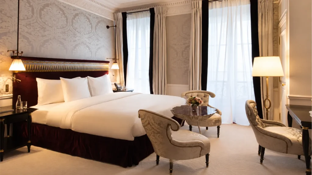 Elegant luxury bedroom with classic furnishings at La Réserve Paris