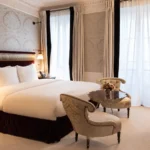 Elegant luxury bedroom with classic furnishings at La Réserve Paris