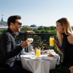 Guests dining on an outdoor terrace with panoramic Paris views at La Réserve Paris