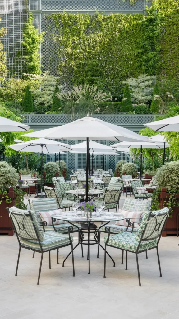 Outdoor garden seating surrounded by greenery at Le Bristol Paris