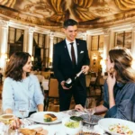 Guests enjoying a refined dining experience at Le Meurice Paris