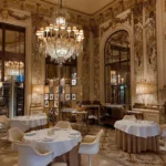 Luxurious dining interior at Le Meurice Paris with crystal chandeliers