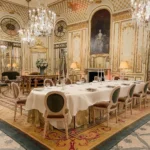 Elegant dining room at Le Meurice Paris with ornate interiors and chandeliers