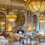 Opulent restaurant interior with chandeliers at Le Meurice Paris