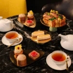 Elegant assortment of pastries, miniature desserts and tea served at Mandarin Oriental Milan