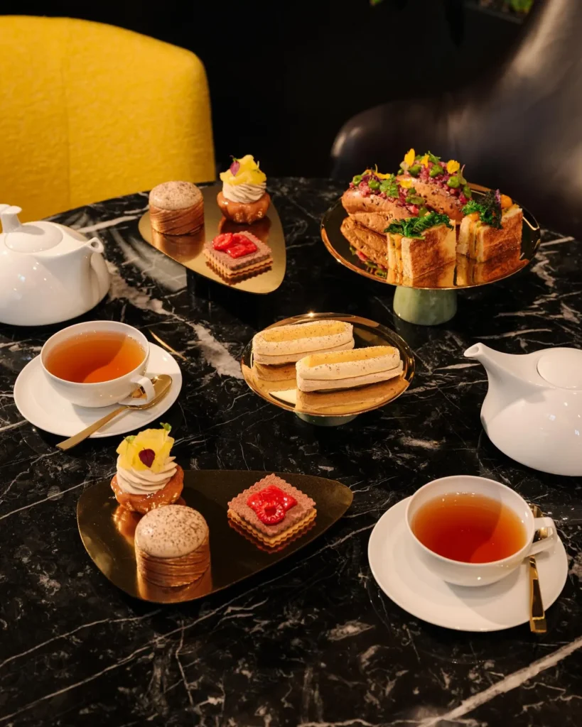 Elegant assortment of pastries, miniature desserts and tea served at Mandarin Oriental Milan