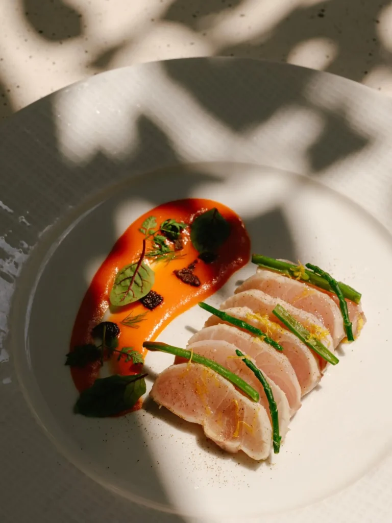 Artfully plated sushi with colorful garnishes served at a fine dining restaurant at Mandarin Oriental Milan