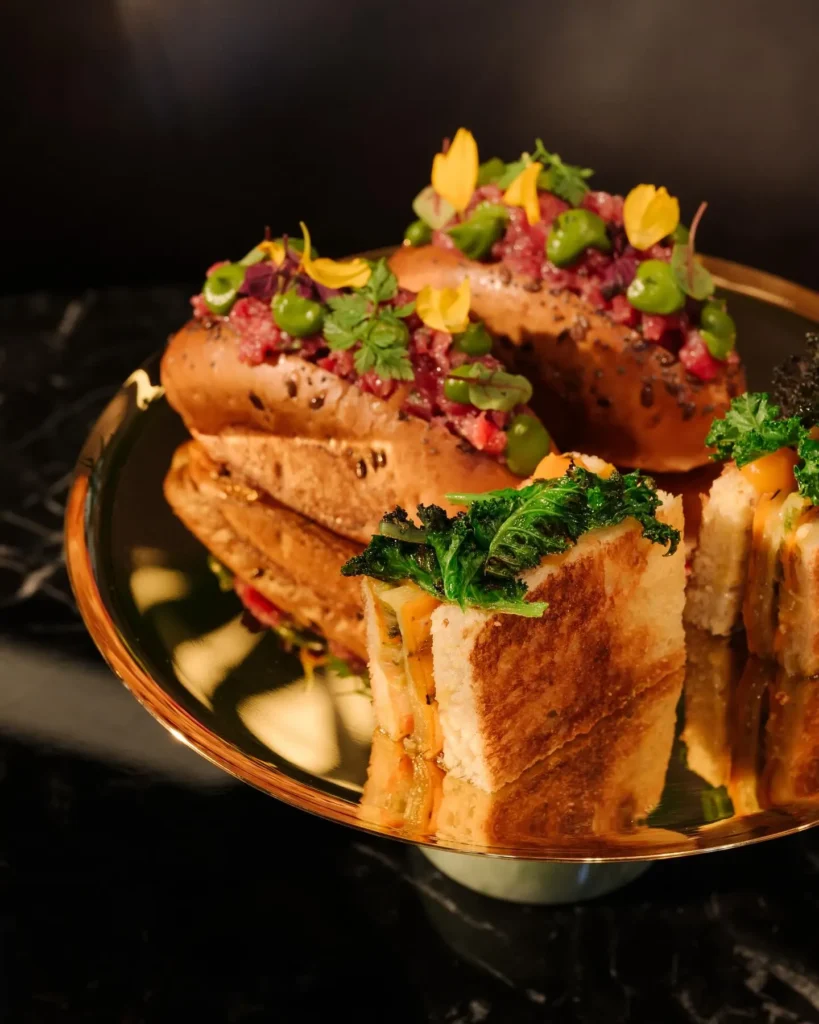 Artfully plated sushi with colorful garnishes served at a fine dining restaurant at Mandarin Oriental Milan
