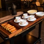 Elegant tea service with teacups, pastries and a silver serving tray at Portrait Milano