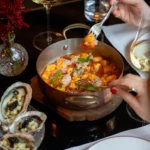 Selection of gourmet Italian dishes, seafood and colorful ingredients served at Portrait Milano