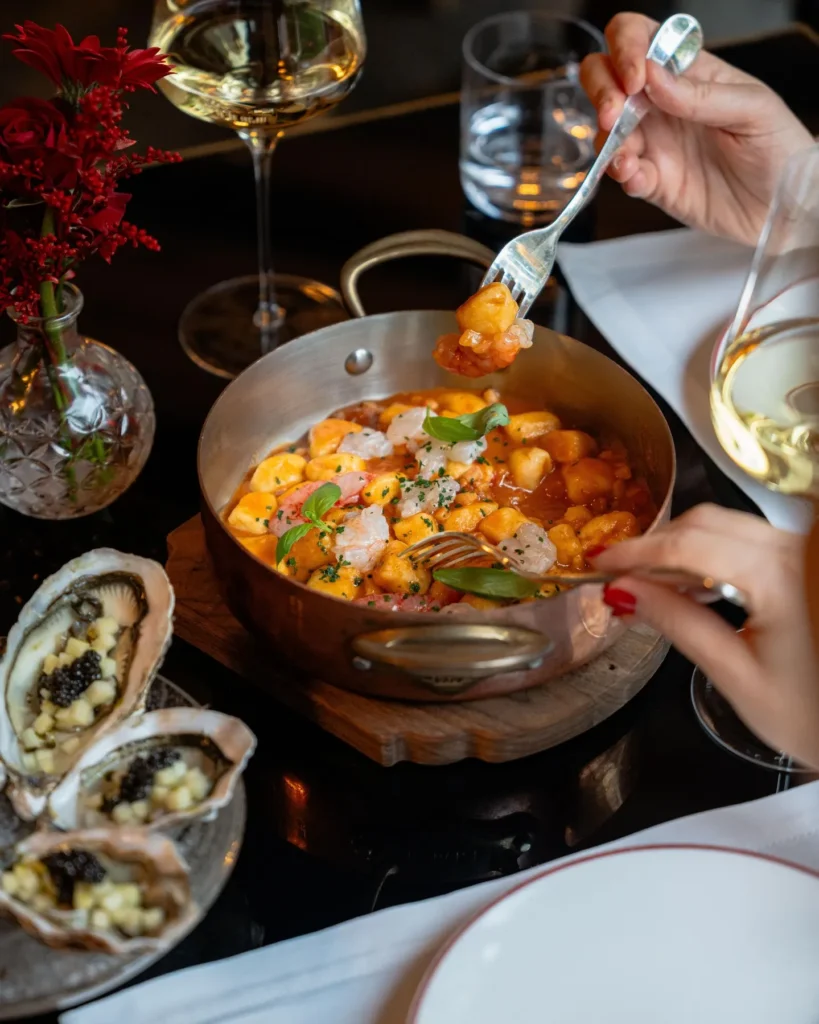 Selection of gourmet Italian dishes, seafood and colorful ingredients served at Portrait Milano