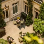Aerial view of the landscaped courtyard and outdoor seating at Rosewood Hôtel de Crillon Paris