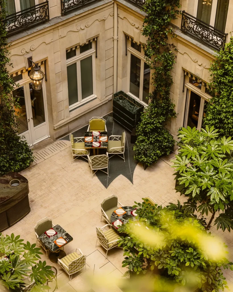 Aerial view of the landscaped courtyard and outdoor seating at Rosewood Hôtel de Crillon Paris