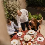 Outdoor dining table set for a meal in the courtyard garden at Rosewood Hôtel de Crillon Paris