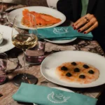 Gourmet seafood dishes presented on elegant tableware at Rosewood Hôtel de Crillon Paris