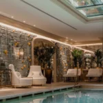 Indoor spa pool surrounded by elegant stone finishes and softly illuminated interiors at Rosewood Hôtel de Crillon Paris